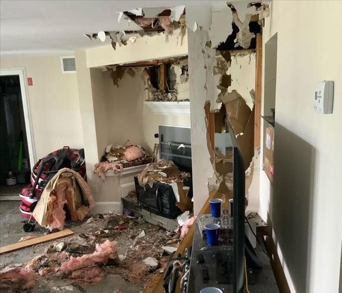 Fire and water damage in a room